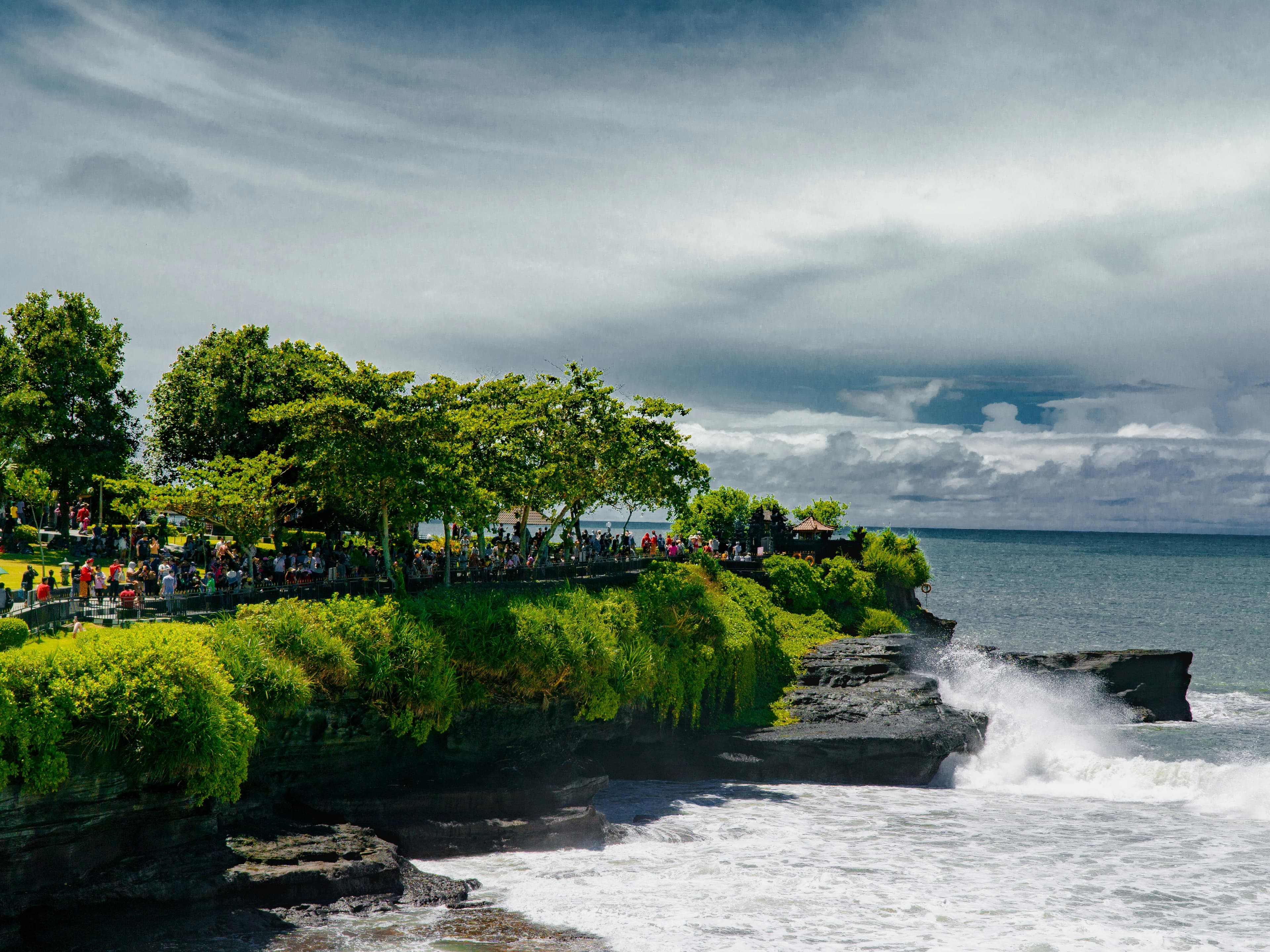 Tanah Lot Temple with ocean waves crashing