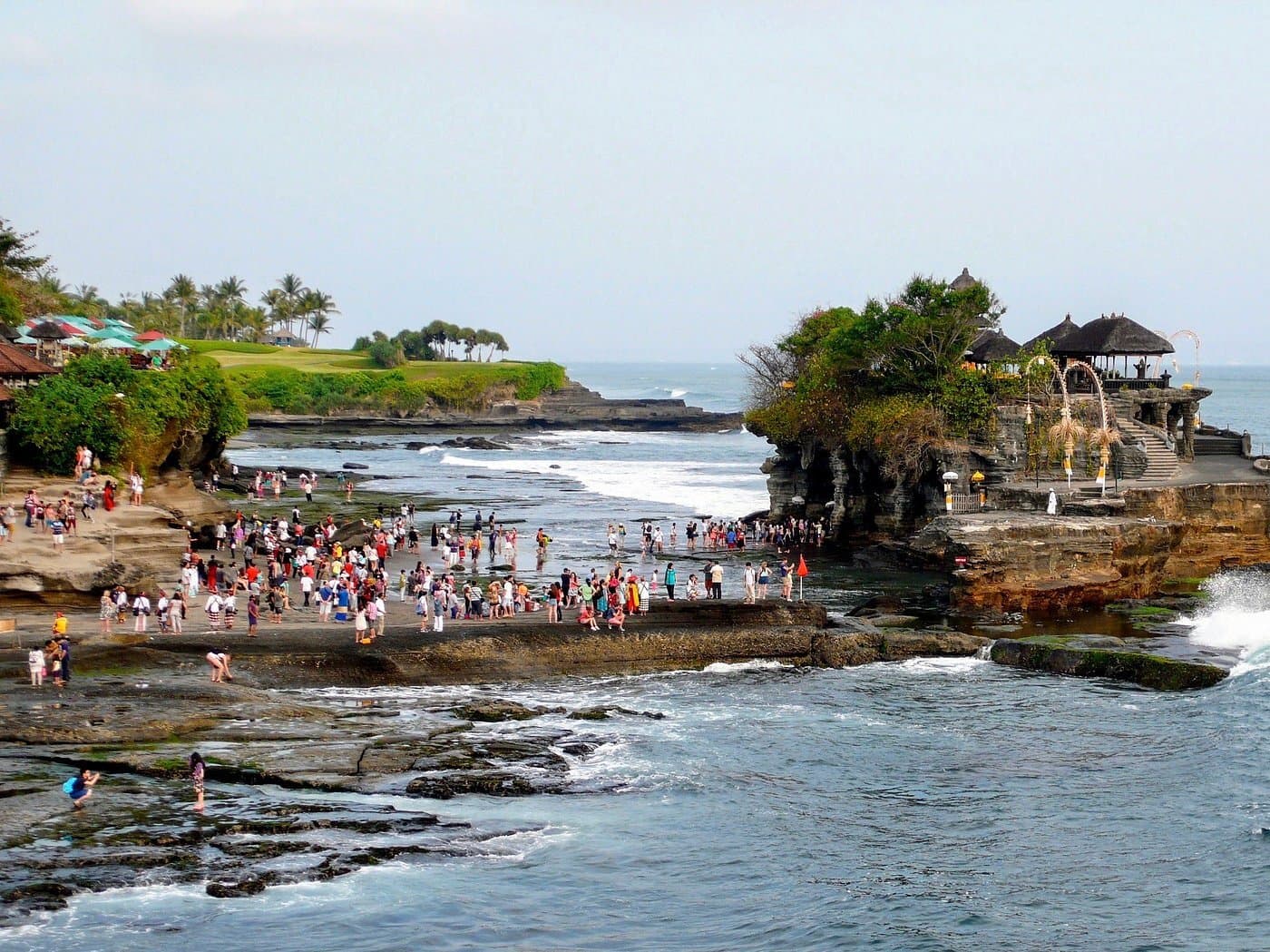 Visitors at Tanah Lot Temple during low tide