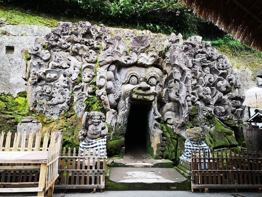 Entrance to Goa Gajah with carved stone facade