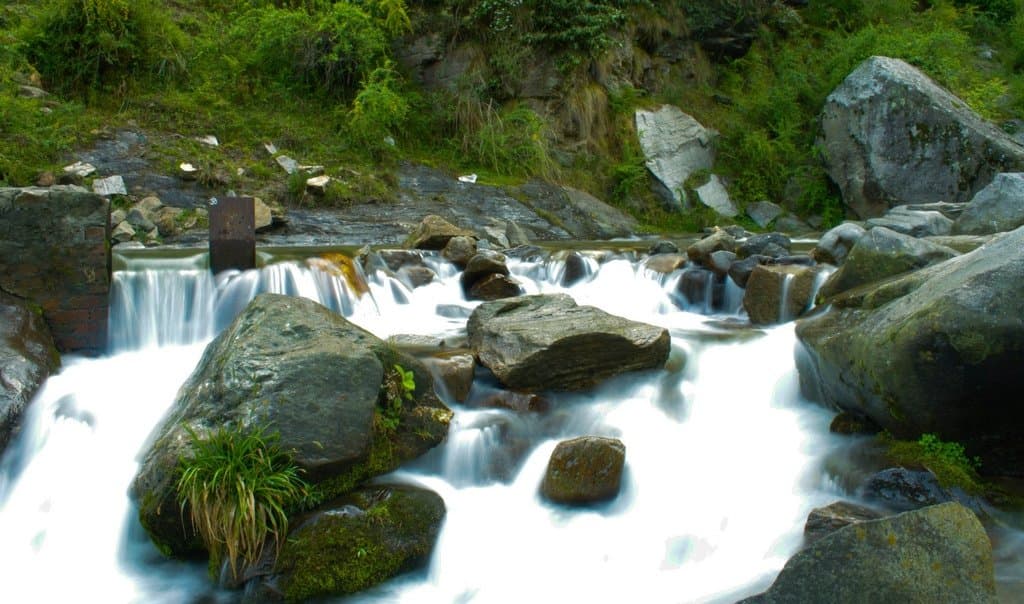 Jogini Waterfall in a serene forest setting