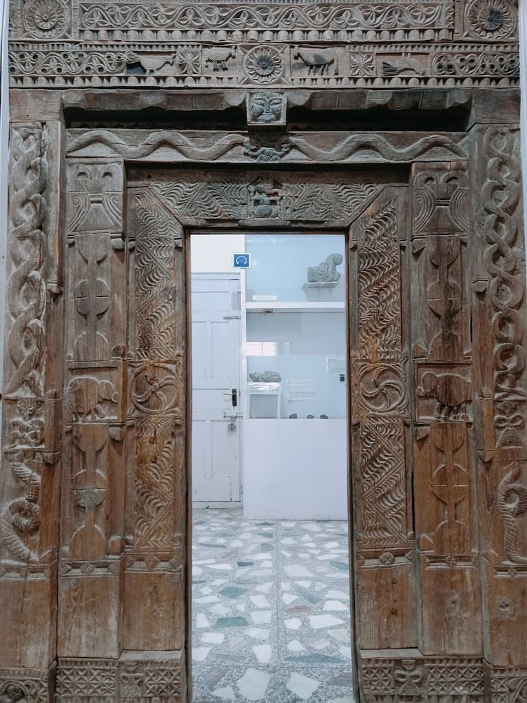 Detailed wooden carvings showcased at the Museum of Himachal Culture and Folk Art