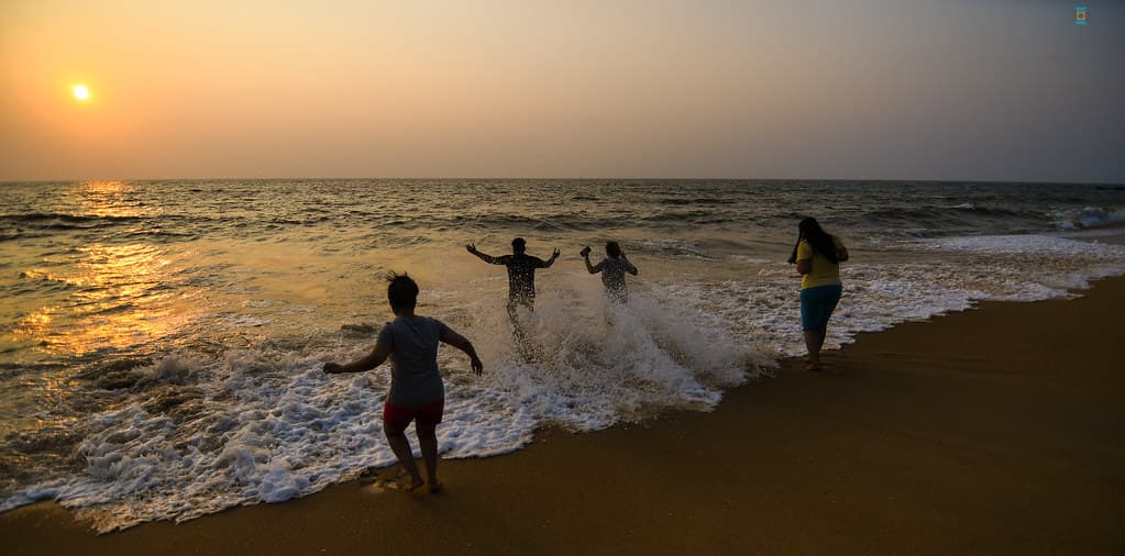 Visitors playing in Someshwara Beach