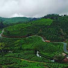 Panoramic road view amidst mountains and blue skies