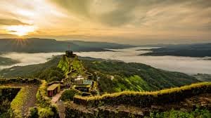 View from Pratapgad Fort overlooking lush green hills