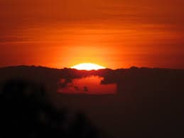 Mumbai Point: Sunset casting a golden glow over hills