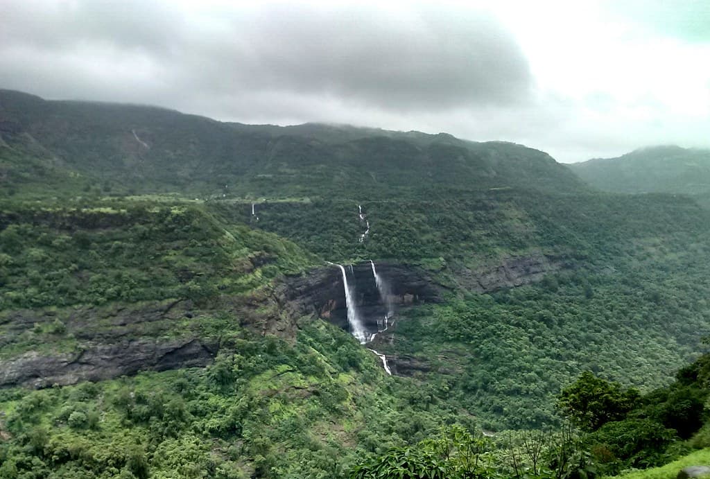 Distance view of Kune waterfall