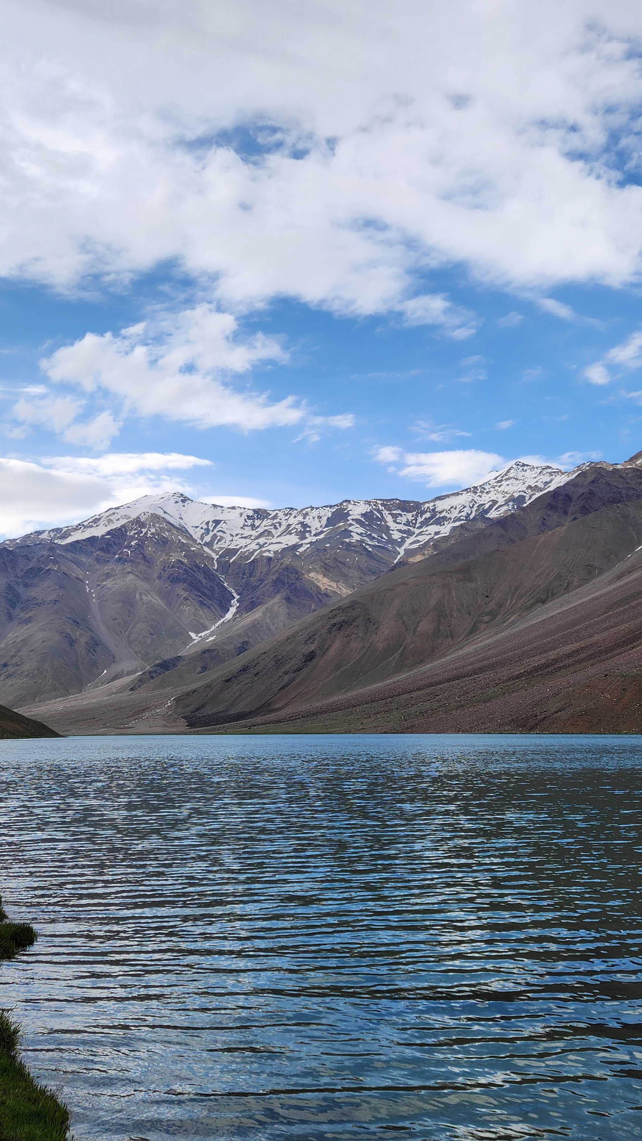 Lake reflecting mountains on Hampta Pass trek