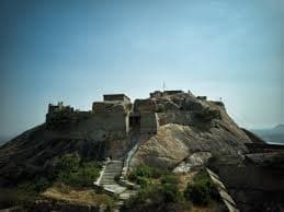 Steps leading up to Gudibande Fort Trek with hill views