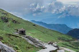 Trekkers ascending the Chandrashila peak near Chopta