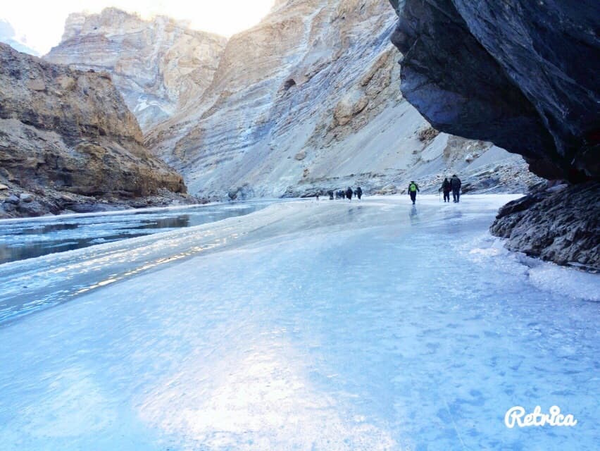 Hikers on the frozen river during Chadar Trek in Kashmir