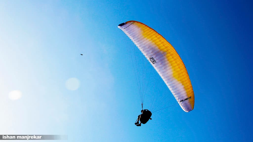 Aerial view of the coastline while paragliding in Anjuna