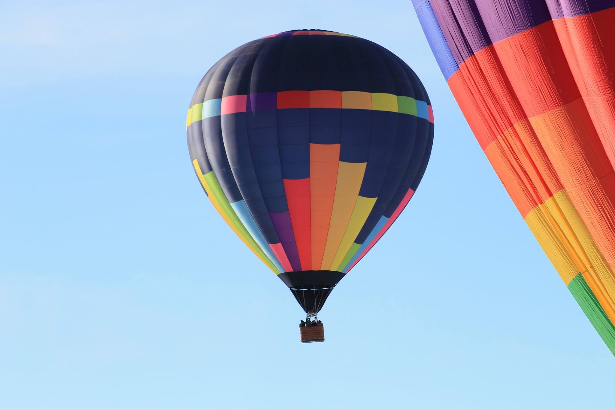 Hot air balloon gliding peacefully over the Goan countryside