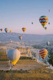 Tourists enjoying the views during a hot air balloon ride