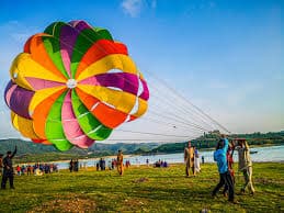 A vibrant hot air balloon filled with tourists