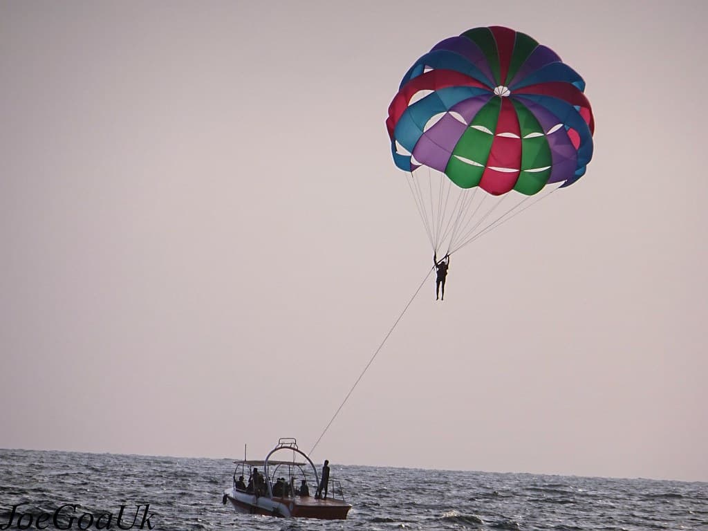 Tourists enjoying a parasailing adventure