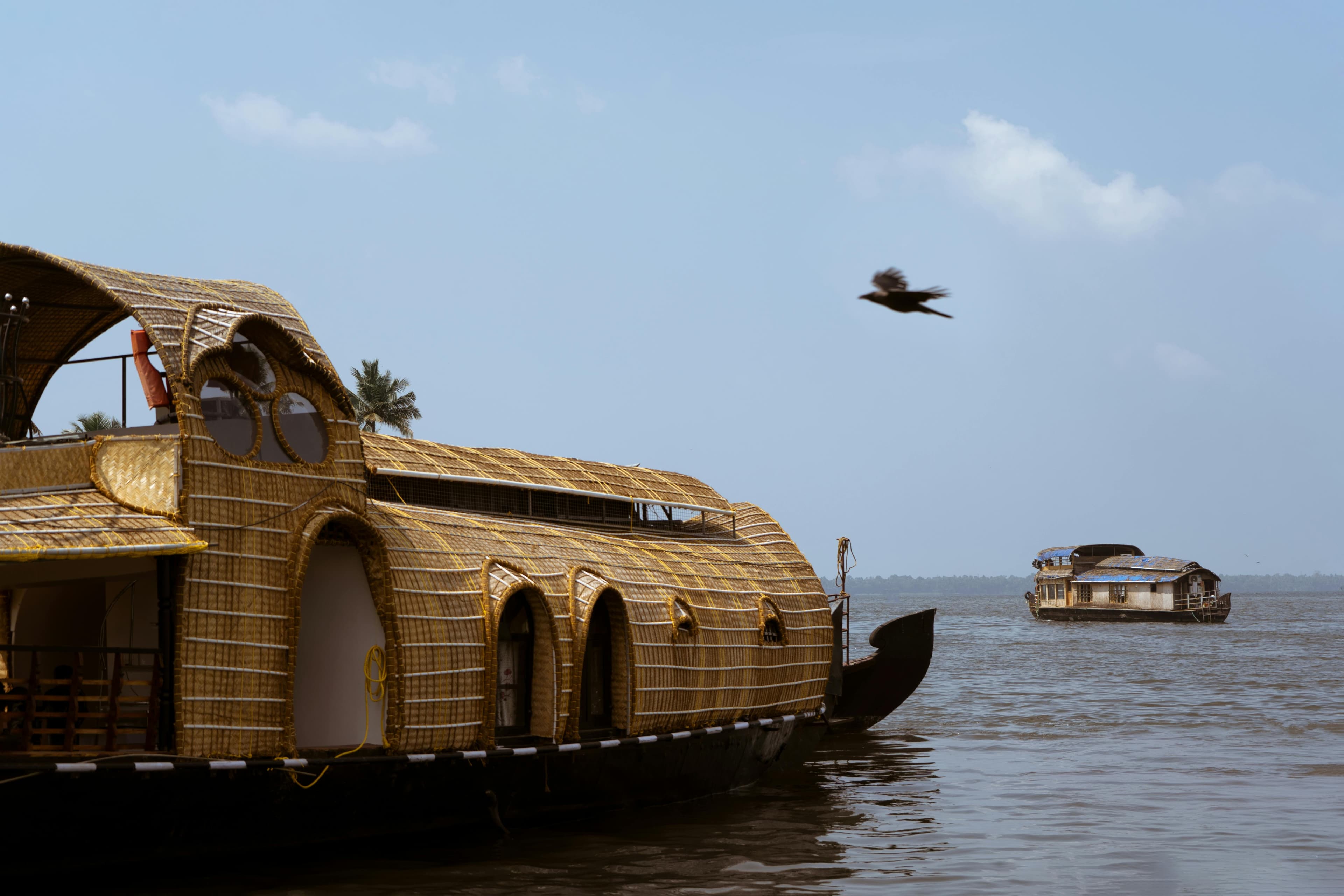 The houseboat gently gliding over the water as the sun sets