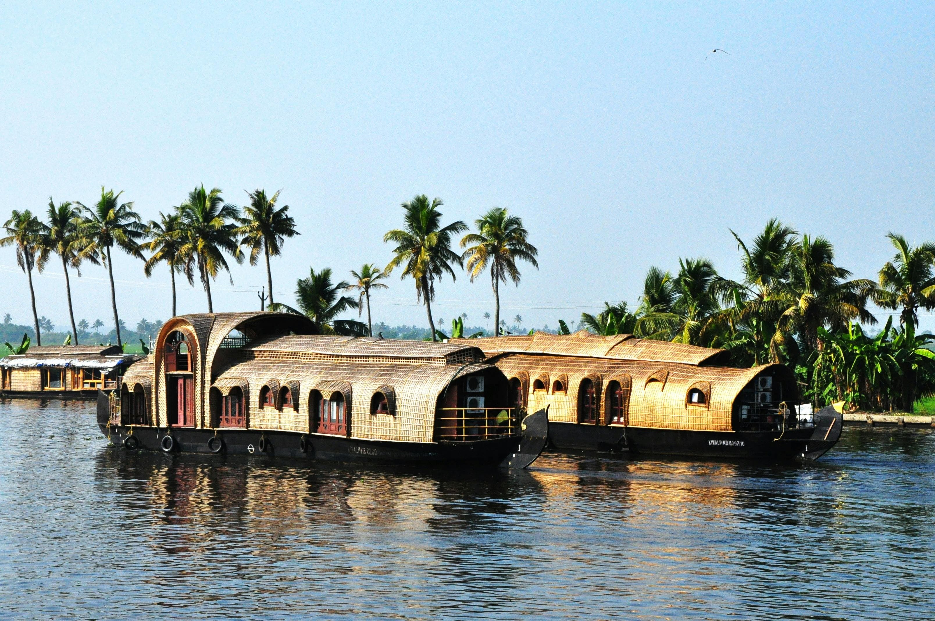 Tourists relaxing on a houseboat during the sunset trip