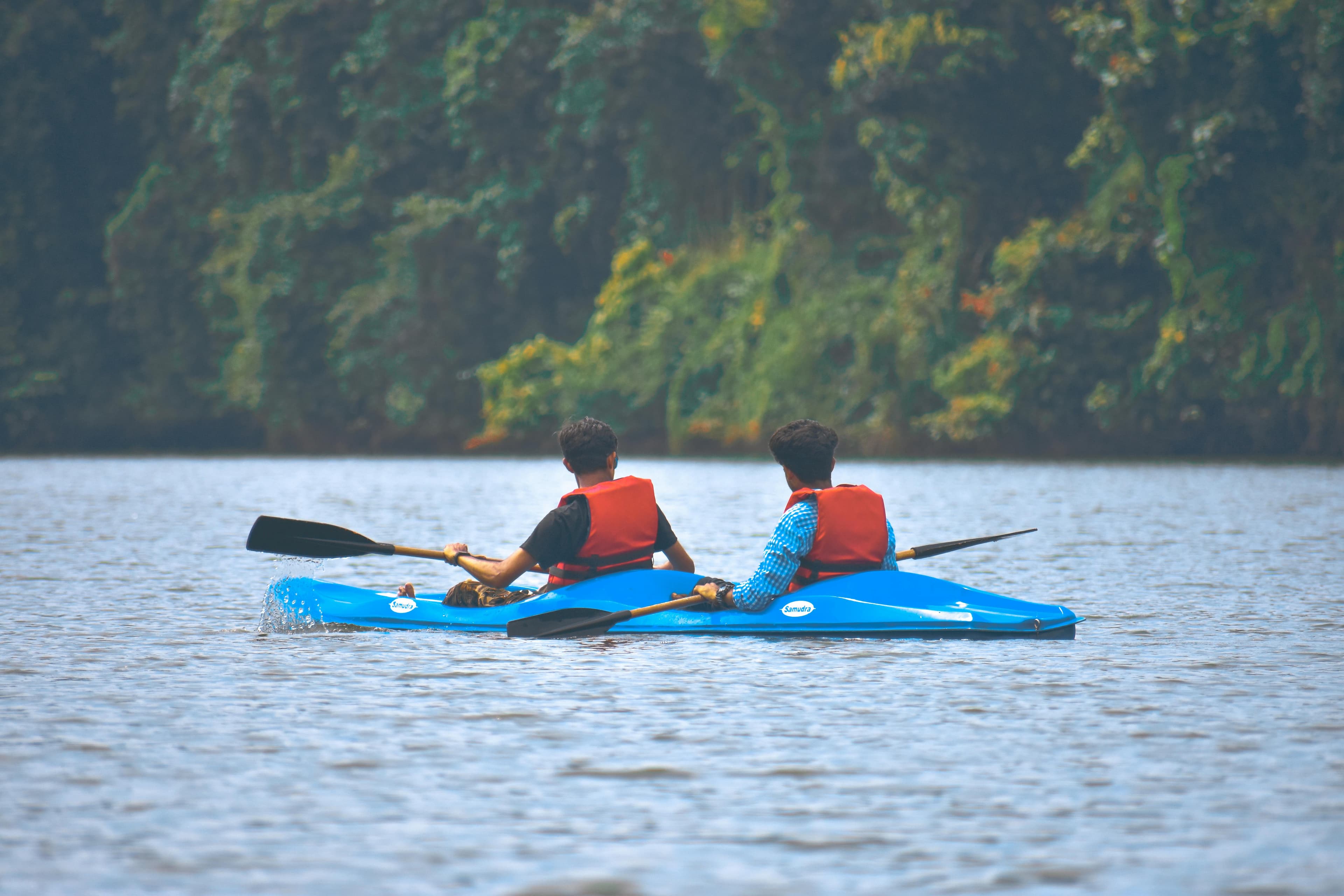 Tourists paddling through the scenic surroundings of Baga Creek