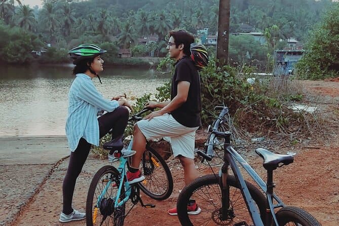 Tourists experiencing the rural charm of Chorao Island by bicycle