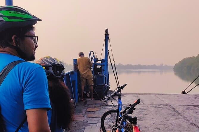 A cyclist riding along a scenic path on Chorao Island