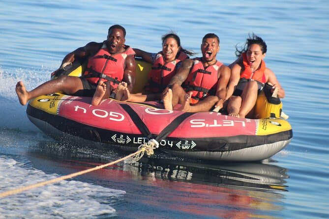 Tourists enjoying water sports at Baga Beach