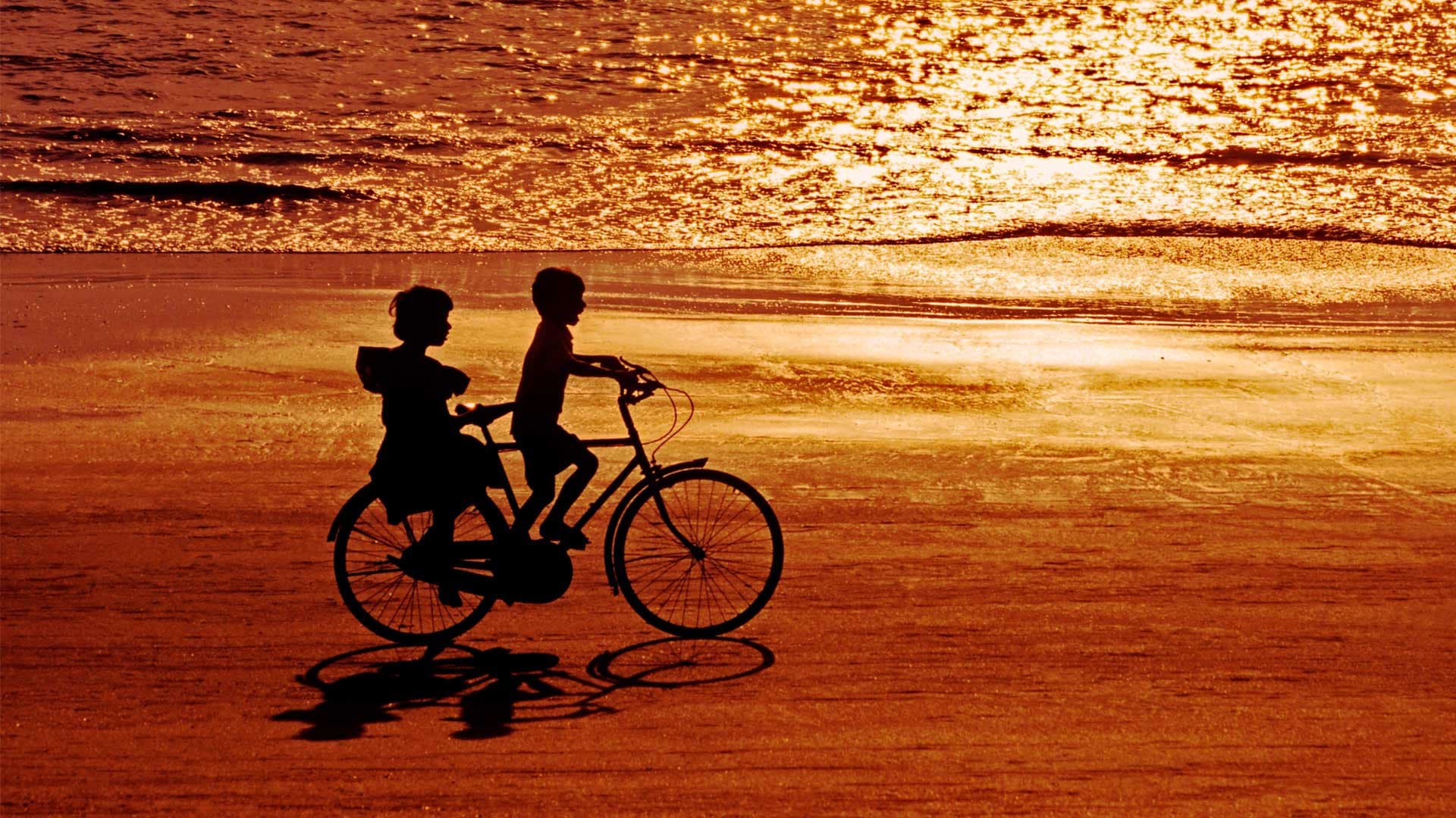 Cycling in the shoreline of Goa Beach