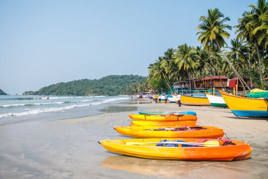 Boats parked at the shoreline of Palolem Beach