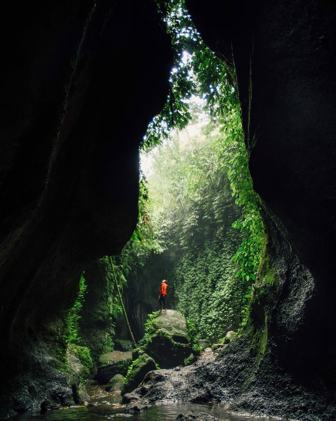 Sun rays through rocks at Tukad Cepung Waterfall