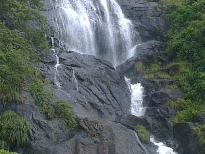 Pandikuzhi waterfall cascading over rocks
