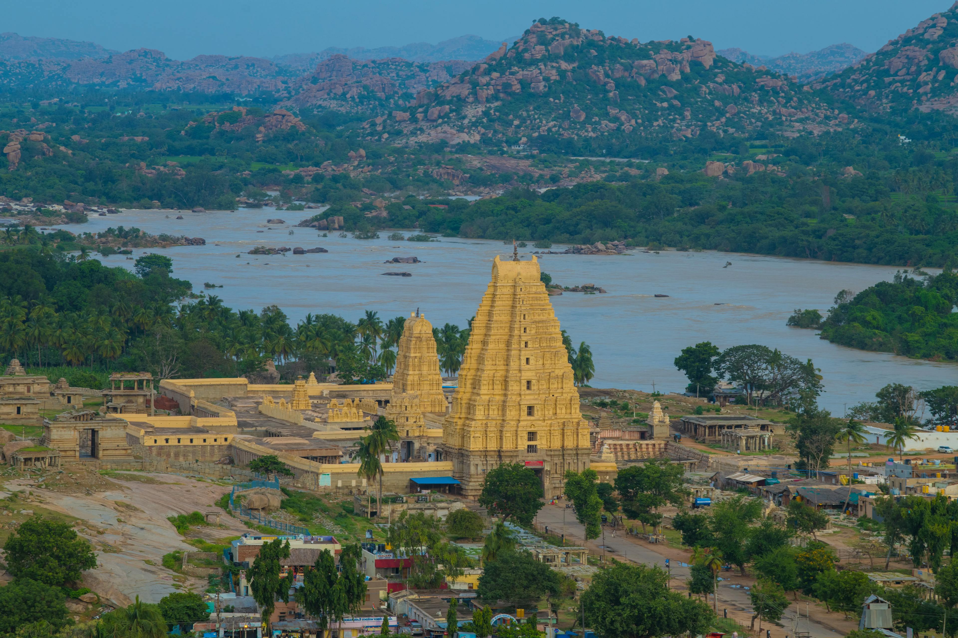 Cultural Harmony: Hampi Weekend Getaway with Gorgeous Riverside Temple Scene